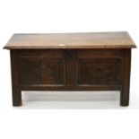 AN OAK BLANKET CHEST, 18TH C, THE FRONT CARVED AT LATER DATE, ON STYLES, THE INTERIOR WITH A TILL,