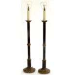 A PAIR OF 'ANTIQUE' AND BLACK PATINATED BRASS ALTAR CANDLESTICK FORM STANDARD LAMPS, 20TH C, 125CM H
