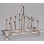 AN EPNS TOAST RACK BASED ON A DESIGN BY DR CHRISTOPHER DRESSER, LATE 19TH C, 13CM H, BY WILLIAM