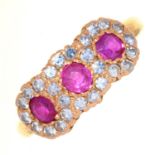 A RUBY AND DIAMOND TRIPLE CLUSTER RING, IN 18CT GOLD, LONDON 1975, 5.1G,  SIZE N½ Good condition,