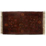 TWO RUGS, 280 X 185CM AND 98 X 56CM The larger rug with some dirt and light staining, otherwise both