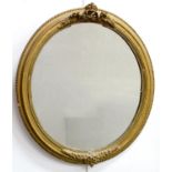 TWO LATE VICTORIAN OVAL GILTWOOD AND COMPOSITION MIRRORS AND A WALNUT MIRROR, VARIOUS SIZES (3)