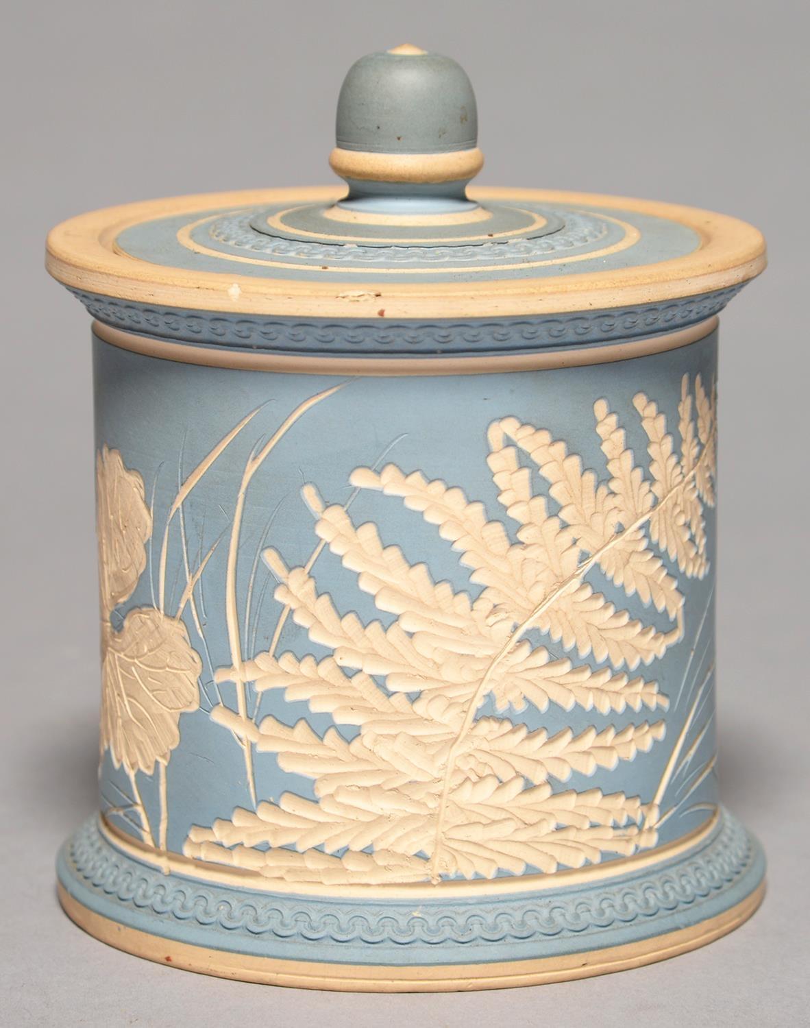 A SALOPIAN ART POTTERY TOBACCO JAR AND COBER, C1900- before 1925, COVERED IN WEDGWOOD BLUE SLIP