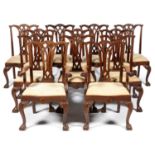 A SET OF TWELVE MAHOGANY DINING CHAIRS, 20TH C, WITH INTERLACED GOTHIC STYLE SPLAT AND CARVED
