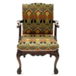 A CARVED MAHOGANY ARMCHAIR, 20TH C, IN GEORGE II STYLE, THE ARMS TERMINATING IN AN EAGLE'S HEAD, THE