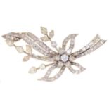 A DIAMOND SPRAY BROOCH, LATE 20TH CENTURY, WITH PEAR SHAPED NAVETTE, BAGUETTE AND ROUND BRILLIANT