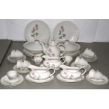 A ROYAL DOULTON BONE CHINA PILLAR ROSE PATTERN DINNER SERVICE