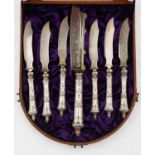 A SET OF SEVEN AUSTRO HUNGARIAN SILVER HAFTED SERVING KNIVES, LATE 19TH C, WITH ETCHED SCIMITAR