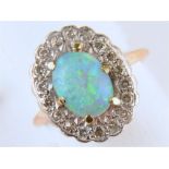 AN OPAL AND DIAMOND CLUSTER RING, IN GOLD, UNMARKED, HEAD 12 X 16MM, 3.4G SIZE L Opal polish dull