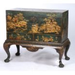 A GREEN JAPANNED CHEST ON STAND, DECORATED WITH CHINOISERIES, THE LID WITH COCK AND HEN ON AN