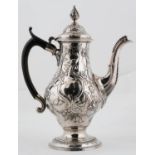 A GEORGE III SILVER COFFEE POT, OF OGEE FORM, FINELY CHASED WITH BIRDS IN BRANCHES, FLOWERS AND