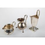 THREE SILVER CREAM JUGS, HELMET SHAPED EXAMPLE 12CM H, ALL BIRMINGHAM, BY VARIOUS MAKERS, 1898, 1900