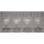 A SET OF FOUR VICTORIAN CUT GLASS GOBLETS, C1870, WITH OVOID STIFF LEAVES BOWL AND WAISTED STEM,  ON