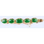 A SOUTH EAST ASIAN JADE SET GOLD BRACELET, APPROXIMATELY 13CM L, MARKED 14, 8.9G Good condition
