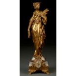 A 19TH C GILTMETAL FIGURE EMBLEMATIC OF SUMMER, HOLDING A SCYTHE CORN IN HER LEFT ARM, A GARLAND