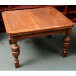 AN OAK DRAW LEAF TABLE, ON LEAF CARVED BULBOUS LEGS, C1930, 74CM H; 98 X 114CM Scratches and