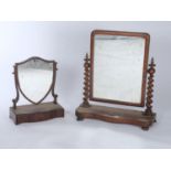 A GEORGE III MAHOGANY SHIELD SHAPED TOILET MIRROR, THE MIRROR PLATE WITHIN BARBER POLE INLAID FRAME,