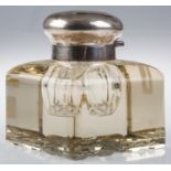 AN EDWARDIAN SILVER MOUNTED CUT GLASS INKWELL, 10.5CM H, MARKS RUBBED Cap dented