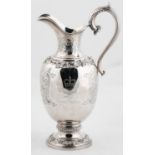 AN ELIZABETH II ROYAL SILVER WEDDING COMMEMORATIVE SILVER CLARET JUG, THE OVOID BODY AND FLARED NECK