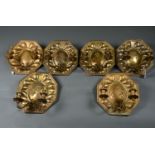 A SET OF SIX OCTAGONAL EMBOSSED AND LACQUERED BRASS TWO BRANCH WALL LIGHTS, THE CENTRES WITH THREE