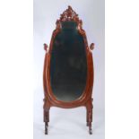 A REPRODUCTION MAHOGANY CHEVAL MIRROR IN VICTORIAN STYLE, THE SHAPED OVAL BEVELLED PLATE WITHIN A