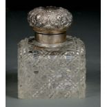 A VICTORIAN SILVER MOUNTED CUT GLASS INKWELL OF UNUSUALLY LARGE SIZE WITH EMBOSSED CAP, 14CM H, BY