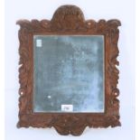 A CONTINENTAL CARVED PINE PICTURE FRAME, C1700, 43 X 34.5CM, SIGHT 25 X 23CM Small old made up