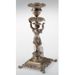 A FRENCH SILVER FIGURAL CANDLESTICK, MID 19TH C, THE LEAFY SCONCE AND DRIP PAN HELD ALOFT BY A