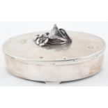 A DANISH OVAL SILVER CONCEALED OPENING JEWEL BOX, THE LID WITH NATURALISTIC CAST FLOWER KNOP,  ON