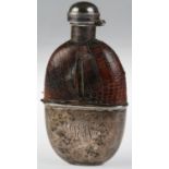 A GEORGE V SILVER MOUNTED GLASS HIP FLASK WITH CROCODILE HIDE COVERED SHOULDER AND DETACHABLE SILVER