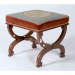 A VICTORIAN ROSEWOOD X-FRAME STOOL, C1850, THE SQUARE TOP UPHOLSTERED IN FLORAL GROS POINT, THE X-