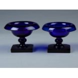 A PAIR OF BRISTOL BLUE GLASS  TAZZE, THE TURN OVER UPPER RIM ABOVE A SHALLOW BOWL WITH KNOPPED