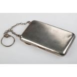 A GEORGE V LADY'S SILVER CIGARETTE CASE INCORPORATING A COMPACT AND MIRROR, CHAIN HANDLE WITH FINGER