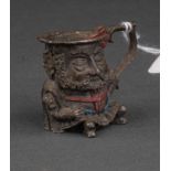 A CONTINENTAL BEARDED DWARF NOVELTY CAST AND COLD PAINTED PEWTER MINIATURE CHAMBERSTICK, 20TH C,