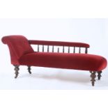 A SEVEN PIECE WALNUT SALON SUITE WITH FOLIATE CARVED TOP RAILS AND SPINDLE GALLERIES TO CHAISE