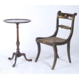 A REGENCY JAPANNED DINING CHAIR, C1820, ON SABRE LEGS WITH CANED SEAT, SEAT HEIGHT 40CM, AND A