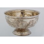 A DUTCH SILVER  FOOTED BOWL WITH EVERTED RIM, CHASED WITH LIVESTOCK AND FLOWERS BETWEEN VACANT