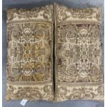 A PAIR OF CUSHIONS, EARLY 20TH C, FACED WITH EARLIER EMBROIDED FRAGMENTS OF FLORAL SCROLLING