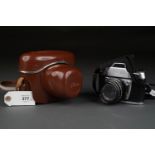 AN IHAGEE EXAKTA IIa 25MM SINGLE LENS REFLEX CAMERA WITH F2 50MM LENS, LEATHER CASE AND AND AN EXA