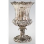 A VICTORIAN SILVER CUP, THE WAISTED BOWL EMBOSSED WITH FLOWERS BENEATH SCROLLING RIM AND ENGRAVED