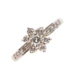 A DIAMOND STAR CLUSTER RING WITH DIAMOND SHOULDERS, IN GOLD MARKED 750, 1.4G, SIZE L Good condition
