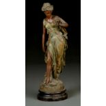 A LATE 19TH CENTURY PATINATED SPELTER FIGURE OF A YOUNG WOMAN, WEARING A DRESS AND HOLDING A  FLOWER