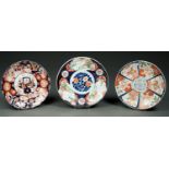 THREE JAPANESE IMARI PLAQUES, EARLY 20TH C, 39CM DIAM AND C Typical gilding wear