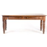 A VICTORIAN MAHOGANY STAINED PINE TWO DRAWER WRITING TABLE, C1870, THE ROUNDED RECTANGULAR TOP