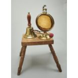 A BRASS DINNER GONG, EARLY 20TH C, 28CM H, A BEATER, BRASS HAND BELL AND AN ASH MILKING STOOL,  ON