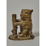 A GILT BRASS BEAR AND RAGGED STAFF NOVELTY INKWELL, C1870, THE BRIDLED HEAD WITH GLASS EYES AND