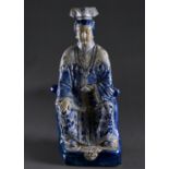 A MONUMENTAL SOUTH EAST ASIAN TIN GLAZED BLUE AND WHITE FIGURE OF A DIGNITARY, POSSIBLY THE