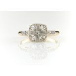 A FIVE STONE DIAMOND CUSHION CLUSTER RING WITH DIAMOND SOULDERS, MILLEGRAIN SET, IN GOLD MARKED