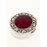 A GEORGE IV OVAL SILVER BOX, THE CHERRY RED GUILLOCHE ENAMEL INSET LID WITHIN PIERCED AND ENGRAVED