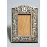 AN INDIAN SANDALWOOD, TORTOISESHELL AND IVORY PHOTOGRAPH FRAME, C1900, THE SURROUND APPLIED WITH